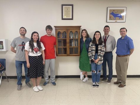 From left: Kenneth Lakowski, Delaney Hansen, Brian Dimraj, Sara Schumacher, Sofia Logacho, Michael Souza, and Nicholas Scipione. Staff and administration worked together with Dimraj to build the Lemke Lending Library, featured at center.
