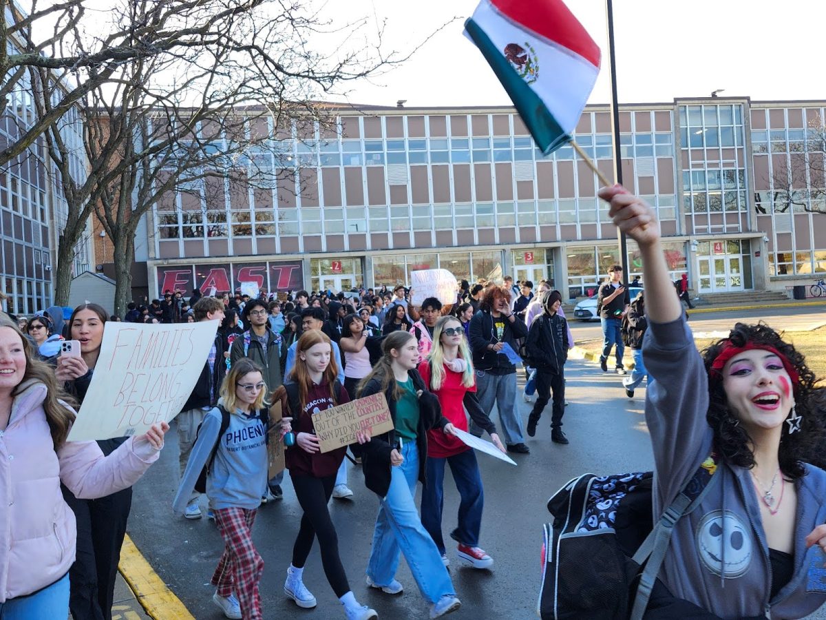 Students congregated outside of Door 1 and began walking towards Wilson Avenue.