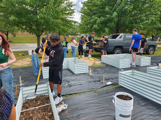 Students working on filling the Garden beds.